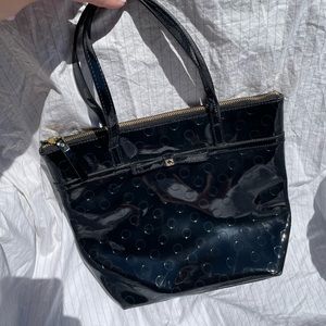 Patent black Authentic Kate Spade with dot pattern and tiny bow.